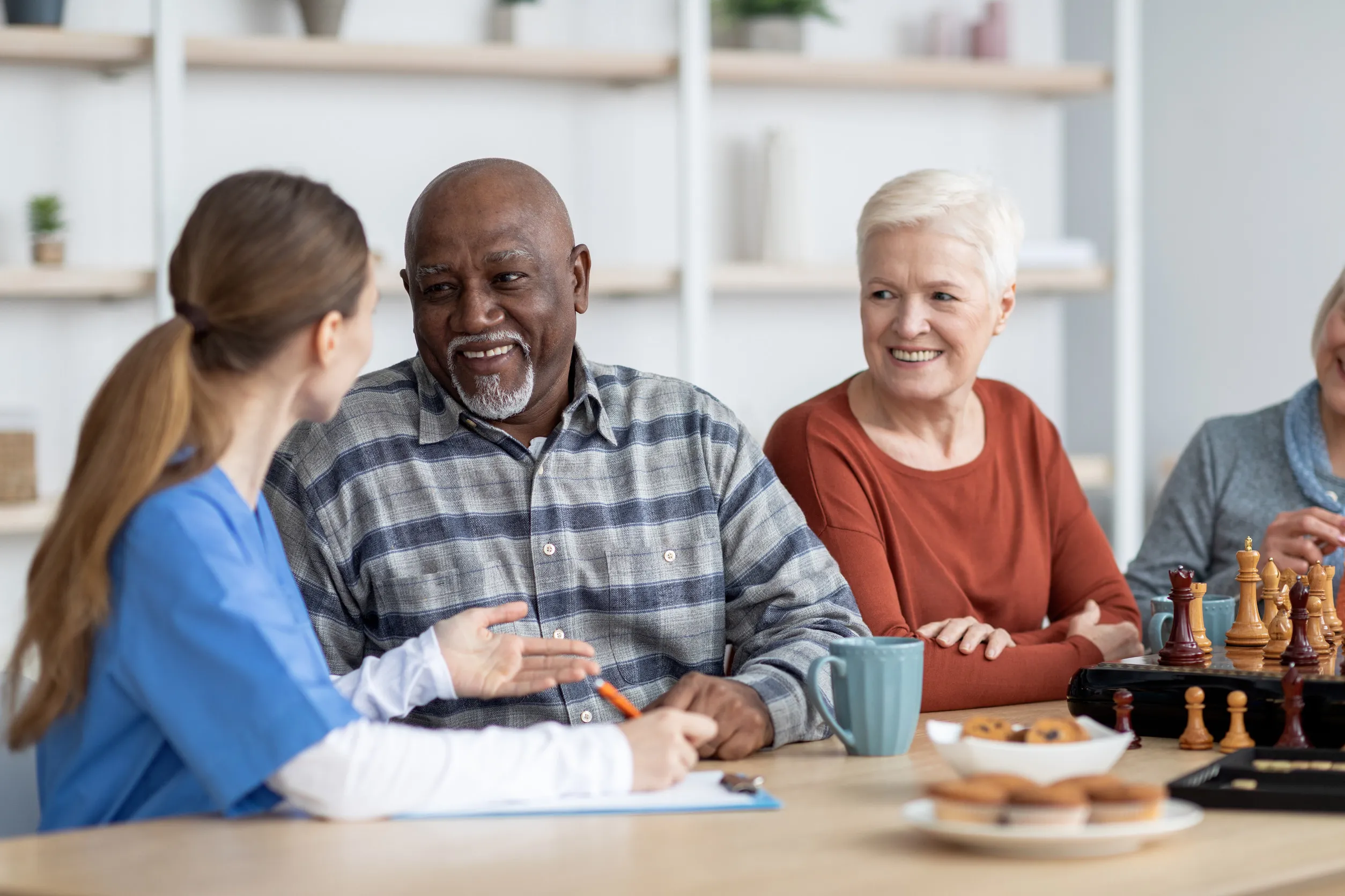 Nurse having conversation with african american senior man Nurse having conversation with african american senior man